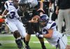 Fayetteville’s Brooks Ellis (13) sacks Bentonville quarterback Dallas Hardison in the fourth quarter. Ellis finished with 3 1/2 sacks. 