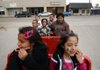 Arkansas Democrat-Gazette/RYAN MCGEENEY --12-03-11--  Lydia Velasco of West Fork, center right, enjoys a ride through Springdale Saturday morning on the Heartland Choo Choo with her son, JuniorVelasco, 10, top right, and her five grandchildren, Sebastian Barranco, 10, top left, Samuel Barranco, 6, center left, Maria Barranco, 7, center, Alex Barranco, 10, bottom left, , and Natalia Barranco, 9, bottom right, during the ninth annual Children's Christmas Train event at the Springdale Train Depot. About 1,700 children were expected to ride the train throughout the day, which ran every hour from the Springdale Train Depot.