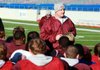 Barton Coach Van Paschal speaks to hsi team at practice Wednesday in War Memorial Stadium in Little Rock in preparation for tonight’s Class 3A state championship game. 