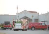 Firefighters with the Fayetteville Fire Department wait outside Washington County Detention Center Friday, Dec. 9, 2011, for equipment to arrive after an envelope containing an unknown white powder was delivered and opened by a female employee at the facility.