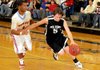 STAFF PHOTO ANTHONY REYES
Pea Ridge junior Evan Tillman (5) drives to the basket as Webb City junior Phoenix Johnson defends in the second half of the Arvest Classic Friday Dec. 9, 2011 at King Arena in Rogers. Pea Ridge lost 61-40.