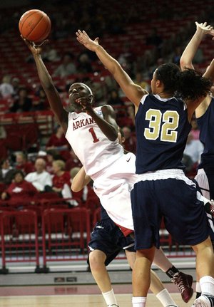 Arkansas’ Keira Peak (1) shoots over Oral Roberts center Dominique Allen during the Razorbacks’ 65-37 victory Saturday at Walton Arena in Fayetteville. 