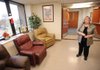 Nadine Huddleston, administrator of the Department of Veterans Affairs’ Fayetteville Veterans Home, gives a tour of the facility Thursday. Huddleston said she’s confident the home has addressed all the violations found earlier this year during inspections and will receive a good report when the home is inspected again early next year.
