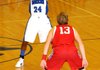 Rogers High Mounties guard Wayne Henry looks for passing room while guarded by the Webb City Cardinals’ Breckin Williams during the Arvest Hoopfest Classic championship game at King Arena in Rogers.