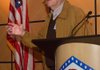Dr. Jerry Stewart, president of the 188th Fighter Wing-Fort Chaffee Community Council, speaks Monday at the Air National Guard base in Fort Smith about the impact of possible military spending cuts on the 188th Fighter Wing.