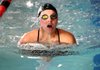 Torie Smith, Springdale High sophomore, swims the breast stroke during practice Friday at the Jones Center in Springdale.