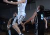 Darian Harris, center, of Shiloh Christian goes up for a basket Dec. 31 during the game against Pea Ridge High School at Shiloh Christian School in Springdale. Harris averages 21 points per game for the Saints.