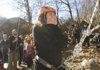 Jensi Chumaja shows her doubts about scaling a cliff during a rock-climing exercise on a Rogers High School outdoor education class field trip. The RHS junior climbed the sheer rock wall with ease. “I don’t think I’m scared of heights anymore,” she said.