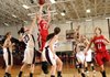 OFFENSIVE FIREPOWER Farmington’s Breanna Jones, top, shoots the ball over Gentry’s Jordan Olds, left, and Shelby Hammond during the Lady Cardinals’ game Thursday against the Lady Pioneers in Gentry.