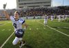 Fayetteville’s Heath McCracken rushes the field as the team celebrates its 29-28 overtime victory over Bentonville on Dec. 3 during the Class 7A state championship game in War Memorial Stadium in Little Rock.