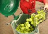 Jared Ward, co-owner of Ozark Tennis Academy, loads used tennis balls into a Green Tennis Machine to restore their bounce by repressurizing them with carbon dioxide. The patented machine is produced by Harrison-based reBounce Inc. and soon on its way to South America where it can be distributed and sold to Brazilian tennis clubs. The foreign business connection was facilitated by the Arkansas World Trade Center in Rogers.
