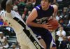  Fayetteville's Tyler McCullough (right) drives past Jonesboro defender Jaffe York during their game Saturday at the Hoops Challenge tournament in Maumelle.