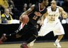 Arkansas State's Bryce Clark (12) drives past Murray State's Jewuan Long (33) in the second half of an NCAA college basketball game on Saturday, Dec. 17, 2011, in Murray, Ky. No. 24 Murray State won 66-53. (AP Photo/Mike Strasinger)
