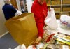 Volunteer Roberta Heaton of Garfield reaches for a pack of frozen venison to place in a bag at God’s Pantry in Garfield on Thursday. The number of meat donations to pantries is in jeopardy because of budget cuts to the Arkansas Hunters Feeding the Hungry program. 