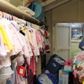 Clothes for children ages zero to twelve months old line a wall in the "baby barn" Wednesday, Dec. 1...