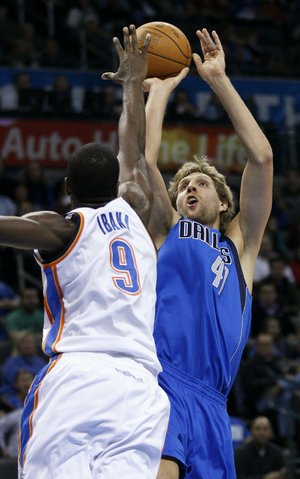 Dirk Nowitzki (right) and the defending NBA champion Dallas Mavericks will be hard pressed to keep up their streak of consecutive 50-win seasons, which sits at 10 seasons, because of the team’s age and the shortened regular season. 