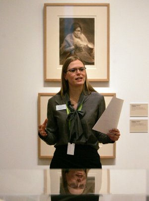 Arkansas Democrat-Gazette/RYAN MCGEENEY --12-22-11-- Crystal Bridges Museum of American Art curatorial assistant Ali Demorotski delivers an introduction to the historical photographs of Edward S. Curtis, who documented North American Indians in the early 20th Century, Thursday in Bentonville. The museum will feature the Curtis exhibit through the early months of 2012.