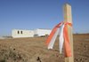 Signs of construction can be seen on Mount Hebron Road at the Rogers-Lowell city limits where the newest Rogers elementary school will be built.
