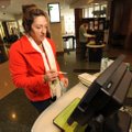 Julia Woodward, a teacher at Ramay Junior High School in Fayetteville, uses a self-checkout station ...