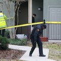 Grapevine police investigate the scene where they found seven people dead outside Dallas in Grapevin...