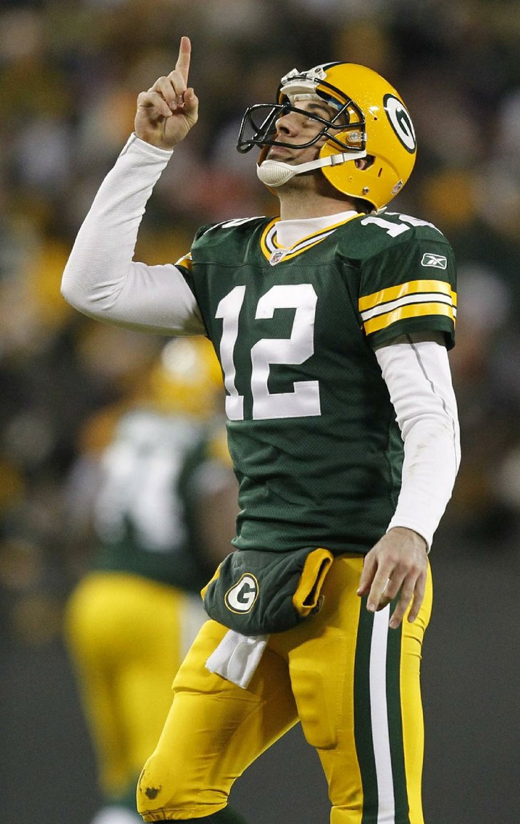 Green Bay Packers quarterback Aaron Rodgers celebrates a touchdown pass