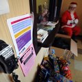 A phone is set up in the lobby of the Peace at Home shelter where William Magee, dressed as Santa Cl...