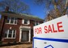 A sign advertises a house for sale at 306 Linwood St. in Little Rock on Wednesday. The Arkansas Realtors Association said new and previously owned home sales were up in November for the fifth consecutive month. 