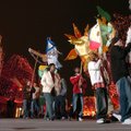 Participants in the ninth annual First Night Fayetteville celebration march around the downtown Squa...