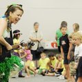Jules Taylor, left, performs children’s songs as part of her Shaky Bugs musical program at the Roger...