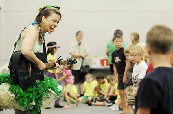 Jules Taylor, left, performs children’s ...