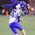STAFF PHOTO ANDY SHUPE
Fayetteville senior receiver Reid Holmes (17) is upended by Little Rock Cath...