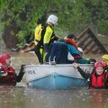 Staff Photo By Spencer Tirey
A water rescue team  works to evacuate residents from the Oak Glen man...