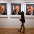 STAFF PHOTO J.S. WEDGEWORTH
A gallery goer walks past Chuck Close's "Clinton Triptych" on Wednesday...
