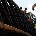 STAFF PHOTO MARC F. HENNING
Josh Button of Pea Ridge jumps Wednesday, July 20, 2011, into Little Su...