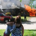 Staff Photo ANTHONY REYES
Babette Atkinson, right, and her sister Amber Burns watch as the Rogers f...