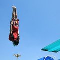 Staff Photo ANTHONY REYES
Ross Walker, 14, flies through the air after jumping off the diving board...