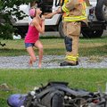 Staff Photo By Spencer Tirey
An unidentified woman pleads with Springdale Fire Fighter Cody Keller ...