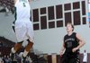 STAFF PHOTO SAMANTHA BAKER
Reece Goddard, right, of Siloam Springs High School, chases after Tulsa Edison Prepatory School's Don Simmons as he flies up to the hoop Friday, Dec. 30, 2011, during the championship game of the Siloam Springs Holiday Invitational hosted at Siloam Springs High School.