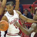 Arkansas guard B.J. Young (center) tries to get past Texas Southern defenders Madarious Gibbs and De...