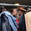 Glenda Nunn moves new donations off a temporary rack Dec. 20 and integrates the items with current m...