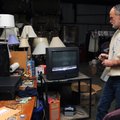 Rick Carnell tests a donated television Dec. 20 at the Salvation Army Thrift Store in Fayetteville. ...