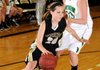 FLEET FEET Brooke Mabeus, Bentonville, left, moves around Van Buren’s Malorie Brown on Friday at the girls’ championship game of the Neosho Holiday Classic in Neosho, Mo.
