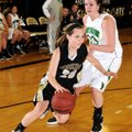 FLEET FEET Brooke Mabeus, Bentonville, left, moves around Van Buren’s Malorie Brown on Friday at the...