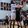 Lindsey Larkin, Siloam Springs, right tries to shoot past the block attempt of Conway High School’s ...