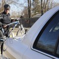 TRAIL PATROL Officer Michael Meadors, with the Bentonville Police Department, unloads a mountain bik...
