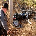 Benton County Sheriff’s Deputy Robert Crowe works at the scene of a motorcycle accident Friday that ...