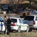 Officials with the Washington County Sheriff’s Office and the Fayetteville Police Department search ...