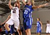 Karen Perez, Springdale High, left, takes the ball to the basket Friday under pressure from Carthage’s Chloe Shepherd during the Lady Bulldog’s game against the Lady Tigers at the Neosho Holiday Classic in Neosho, Mo.

