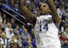 Kentucky's Michael Kidd-Gilchrist (14) shoots over Louisville's Rakeem Buckles during the second half of an NCAA college basketball game in Lexington, Ky., Saturday, Dec. 31, 2011. Kentucky won 69-62. 