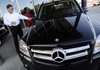 Eddie Stockburger, left, a sales representative points out features on a 2012 Mercedes-Benz GLK350 to Deborah Wright, of Rogers, at Mercedes-Benz of Northwest Arkansas in Bentonville. Wright said she was out shopping for a new or preowned vehicle. Sales of new cars are slowly growing as consumer confidence in the economy improves.
